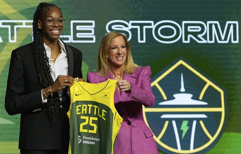 Dominique Malonga, left, poses with WNBA commissioner Cathy Engelbert after being selected second overall by the Seattle Storm during the first round of the WNBA basketball draft, Monday, April 14, 2025, in New York.