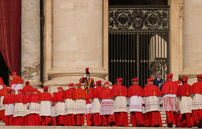 FILE – Cardinals walk through St. Peter’s Square ahead of Pope Francis’ coffin at the Vatican, Wednesday, April 23, 2025. (AP Photo/Andreea Alexandru, File) NYRL412 NYRL412