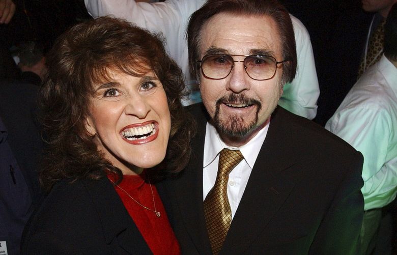 FILE – “Rowan & Martin’s Laugh-In” co-stars Ruth Buzzi and Gary Owens share a laugh during NBC’s 75th Anniversary Party, in Los Angeles, Jan. 9, 2002. (AP Photo/Rene Macura, File) LLT125 LLT125