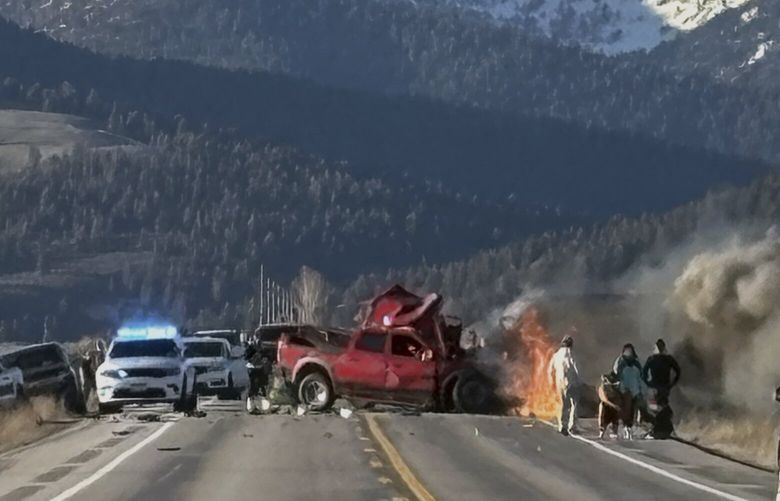 Rescue workers arrive to the scene after a deadly collision between a pickup truck and tour van near Henry’s Lake State Park in eastern Idaho on Thursday, May 1, 2025.   (Roger Merrill via AP) IDHO101 IDHO101