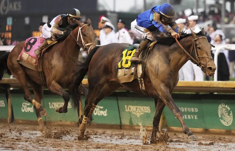 Sovereignty, right, ridden by Junior Alvarado, crosses the finish line to win the 151st running of the Kentucky Derby horse race followed by Journalism, ridden by Umberto Rispoli, at Churchill Downs Saturday, May 3, 2025, in Louisville, Ky. (AP Photo/Jeff Roberson) KYJR153 KYJR153