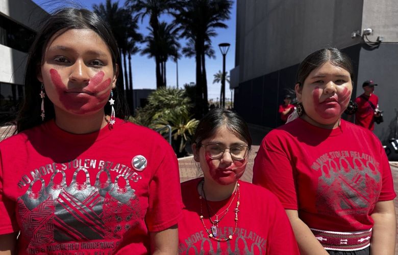 This photo provided by the Phoenix Indian Center shows from left, Yaretzi Ortega, Demetria Collins and Avery Hubbell, members of the Future Inspired Native American Leaders Youth Council, during a Missing and Murdered Indigenous People awareness event in Phoenix, Arizona, on Saturday, May 3, 2025. (Levi Long/Phoenix Indian Center via AP) AZHO101 AZHO101