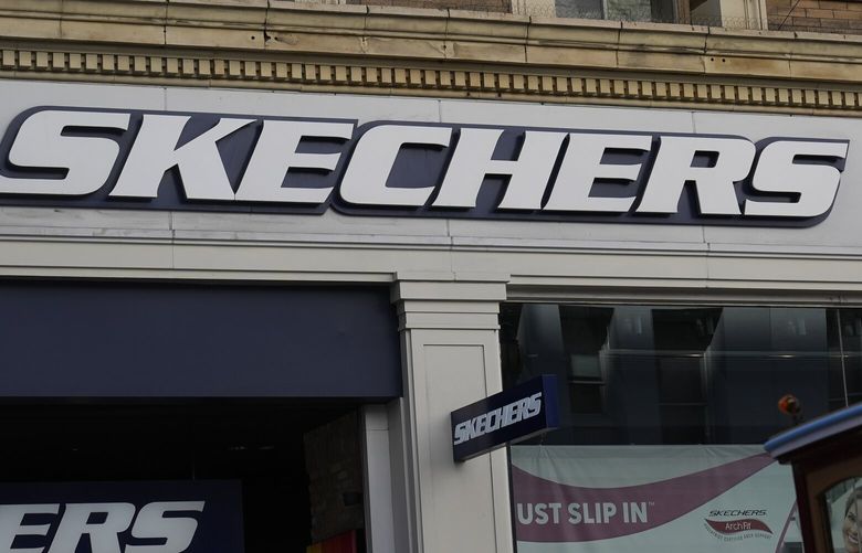 FILE – A Skechers sign is shown in San Francisco, March 17, 2024. (AP Photo/Jeff Chiu, file) NYPS206 NYPS206