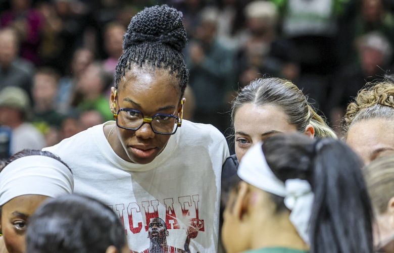 Seattle Storm Dominique Malonga huddles with her teammates Sunday afternoon at Climate Pledge Arena in Seattle, Washington, on May 4, 2025. The Storm lead 45-32 at the half. 229943