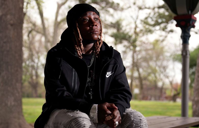 Tazz Webster, who ultimately wound up homeless after an apartment manager allegedly ridiculed and shoved him because he is transgender, poses for a photo, April 9, 2025, in St. Louis. (AP Photo/Jeff Roberson) MOJR406 MOJR406