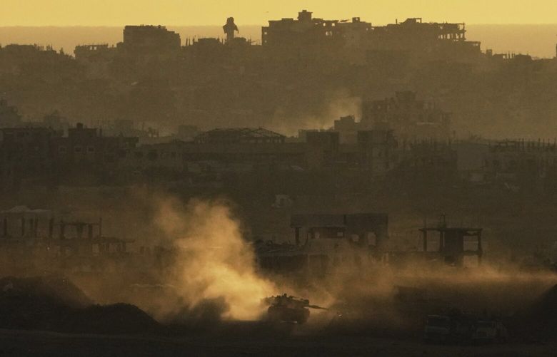 An Israeli army tank maneuvers in the Gaza Strip is seen from southern Israel, Sunday, May 4, 2025. (AP Photo/Ariel Schalit) XOB119 XOB119