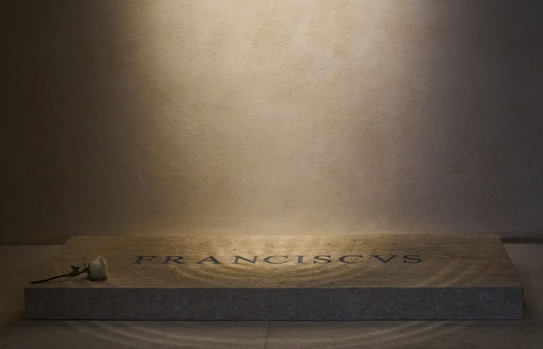A white rose is placed on the tomb of Pope Francis inside St. Mary Major Basilica in Rome, Monday, April 28, 2025. (AP Photo/Bernat Armangue) XBL104 XBL104
