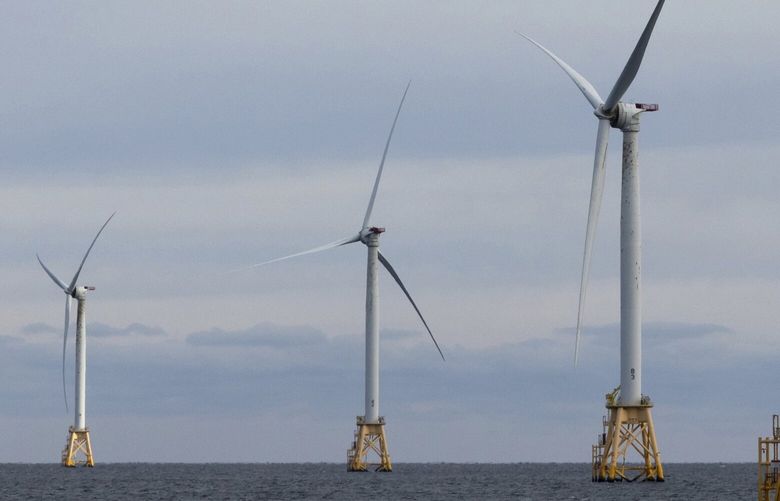 FILE – Turbines operate at the Block Island Wind Farm, Dec. 7, 2023, off the coast of Block Island, R.I., during a tour organized by Orsted. (AP Photo/Julia Nikhinson, File) CLI401 CLI401