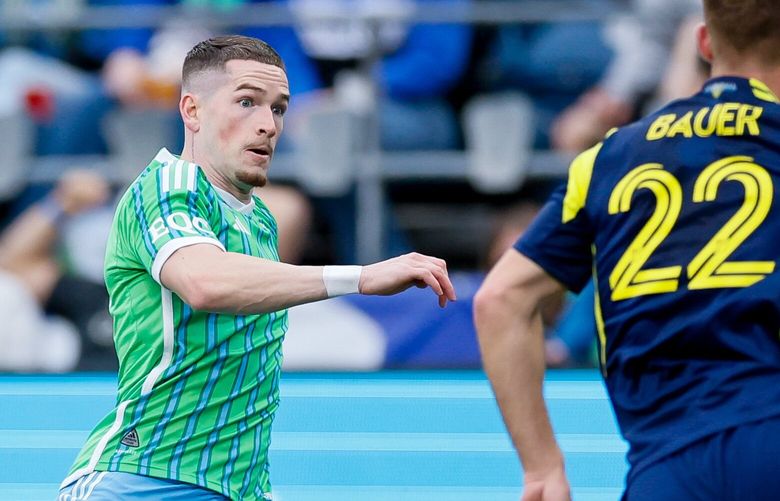 Seattle Sounders FC midfielder Ryan Kent goes for the Balla with Nashville SC defender Josh Bauer during the second half Saturday, April 19, 2025 in Seattle. 229791