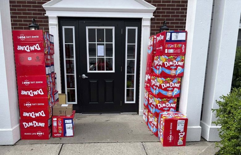 This image provided by Holly LaFavers shows boxes of Dum-Dum lollipops outside of Holly LaFavers’s home Monday, May 5, 2025, in Lexington, Ky. (Holly LaFavers via AP) KYEV203 KYEV203