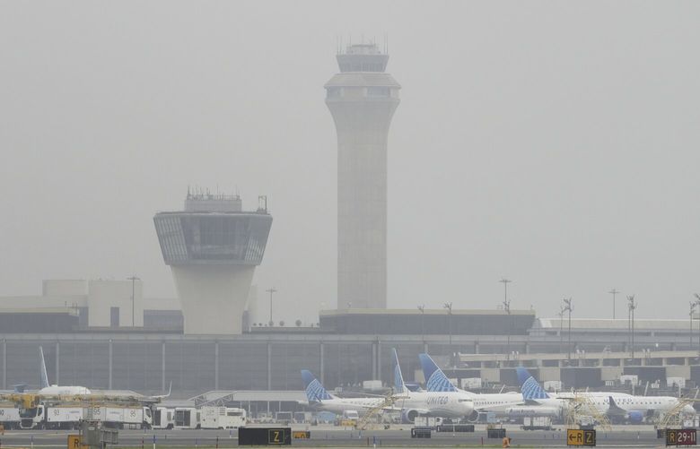 Fog covers planes and control towers at Newark Liberty International Airport in Newark, N.J., Monday, May 5, 2025. (AP Photo/Seth Wenig) NJSW202 NJSW202