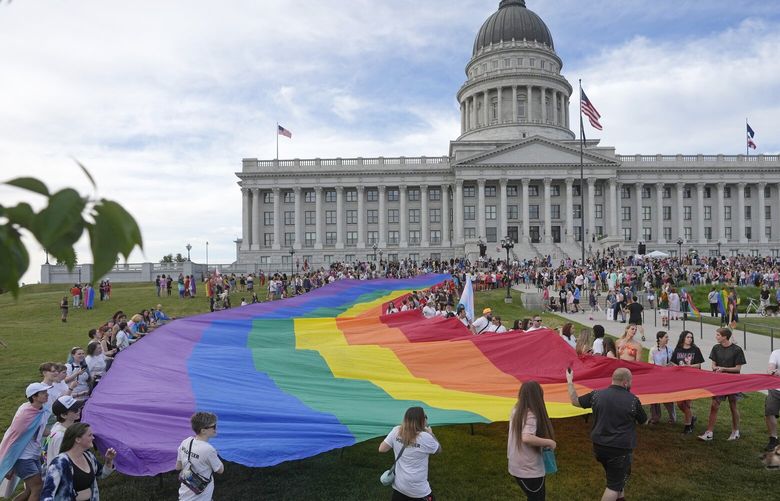 FILE – People march following a Pride rally at the Utah State Capitol, June 2, 2023, in Salt Lake City. (AP Photo/Rick Bowmer, File) NYPS213 NYPS213