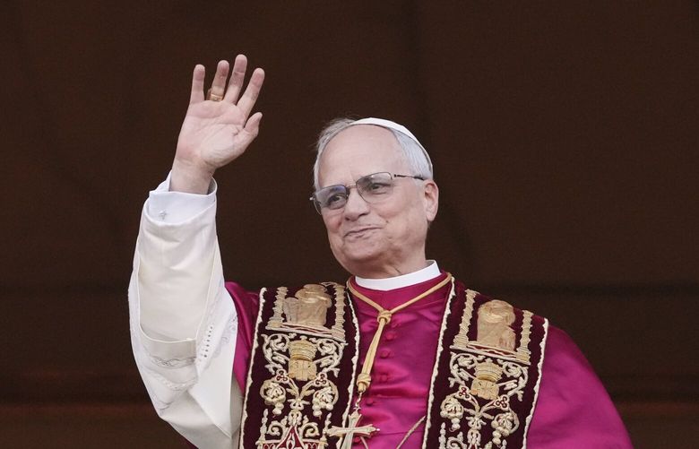 Cardinal Robert Prevost appears on the central loggia of St. Peter’s Basilica after being chosen the 267th pontiff of the Roman Catholic Church, choosing the name of Pope Leo XIV, at the Vatican, Thursday, May 8, 2025. (AP Photo/Alessandra Tarantino) XAF144 XAF144