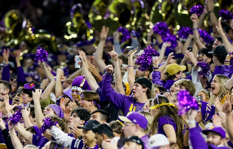 Washington Huskies fans cheer during the first quarter of the National Championship game against Michigan Monday, Jan. 8, 2024 in Houston. 225907