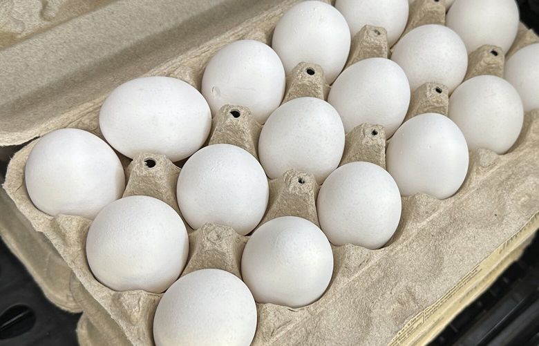 A carton of eggs sits open on the shelf in a refrigerated display case in a Walmart store Monday, May 5, 2025, in Englewood, Colo. (AP Photo/David Zalubowski) OTKDZ101 OTKDZ101