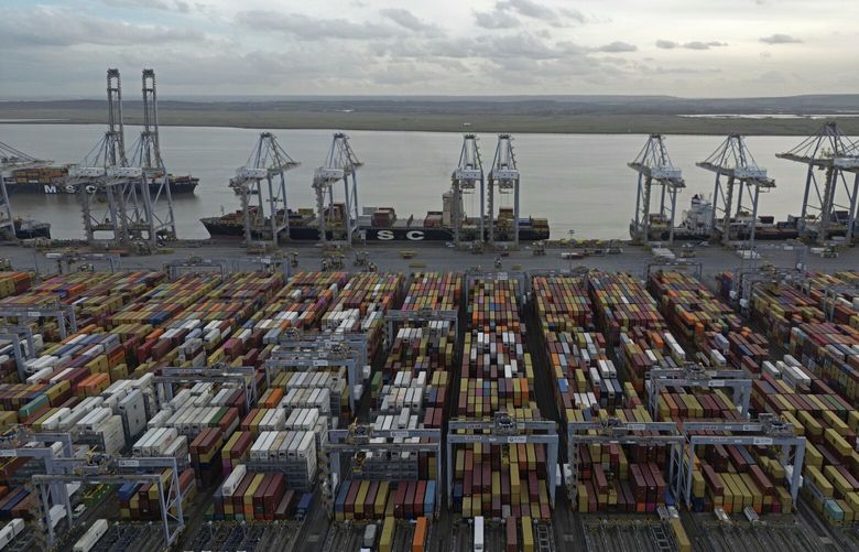 FILE – Shipping containers wait to be processed at London Gateway port, in Stanford-le-Hope, on the Thames estuary east of London, England, Wednesday, Feb. 5, 2025. (AP Photo, File) LGK301 LGK301