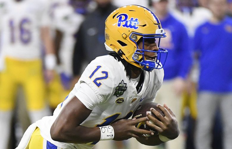 Pittsburgh quarterback Julian Dugger (12) runs with the ball against Toledo during the first half of the GameAbove Sports Bowl NCAA college football game, Thursday, Dec. 26, 2024, in Detroit. (AP Photo/Jose Juarez)