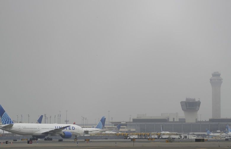 Fog covers planes and control towers at Newark Liberty International Airport in Newark, N.J., Monday, May 5, 2025. (AP Photo/Seth Wenig) NJSW201 NJSW201