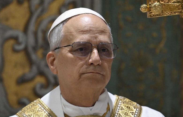 Newly elected Pope Leo XIV concelebrates Mass with the College of Cardinals inside the Sistine Chapel at the Vatican the day after his election as 267th pontiff of the Roman Catholic Church, Friday, May 9, 2025. (Vatican Media via AP) XDS119 XDS119