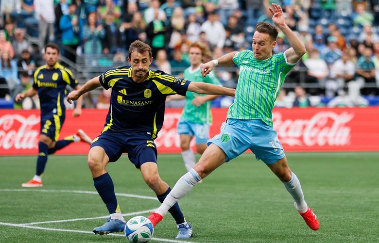 Seattle Sounders FC forward Danny Musovski pokes the ball away from Nashville SC defender Jack Maher during the first half Saturday, April 19, 2025 in Seattle. 229791