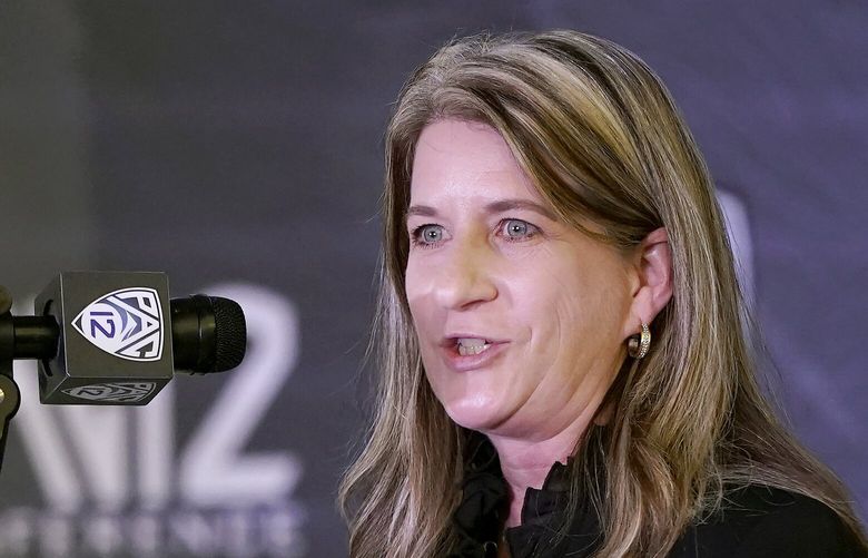 FILE – Pac-12 Senior Associate Commissioner Teresa Gould speaks during Pac-12 Conference NCAA college basketball media day Tuesday, Oct. 12, 2021, in San Francisco. The Pac-12 has promoted Teresa Gould to commissioner as the conference tries to navigate a murky future. “Teresa’s deep knowledge of collegiate athletics and unwavering commitment to student-athletes makes her uniquely qualified to help guide the Pac-12 Conference during this period of unprecedented change in college sports,” Washington State University President and Pac-12 Board of Directors chair Kirk Schulz said in a statement on Monday, Feb.19, 2024. (Jeff Chiu/AP)