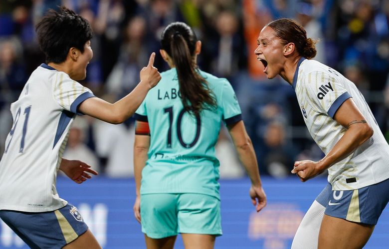 Reign forward Lynn Biyendolo celebrates her goal nt he 37th minute with teammate Ji So-Yun.  The Seattle Reign FC played the Kansas City Current in NWSL Soccer Friday, May 2, 2025 at Lumen Field, in Seattle, WA. 229852