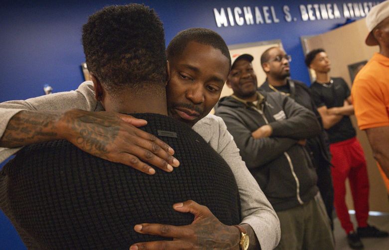 Keith Wheeler, 45, left, of Rainier Beach High School’s 1998 graduating class, embraces former NBA All-Star Jamal Crawford, right, during a dedication ceremony for the Betty Patu Library, Michael S. Bethea Athletics Complex, and the Jamal Crawford Basketball Court inside the new Rainier Beach High School building in Seattle on Saturday, May 10, 2025. 230062
