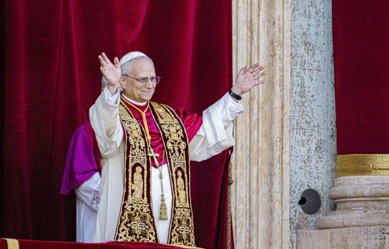 Newly elected Pope Leo XIV, formerly Cardinal Robert Francis Prevost, appears on the central loggia of St. Peter’s Basilica at the Vatican shortly after his election as the 267th pontiff of the Roman Catholic Church, Thursday, May 8, 2025. (AP Photo/Domenico Stinellis) XDS120 XDS120
