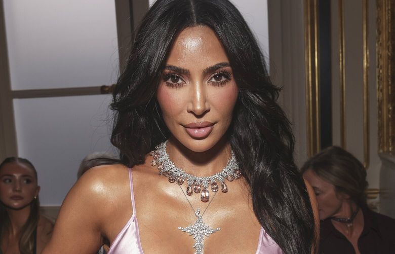 FILE – Kim Kardashian attends the Victoria Beckham Spring/Summer 2024 womenswear fashion collection presented on Sept. 29, 2023 in Paris. (AP Photo/Vianney Le Caer, File) XPAG129 XPAG129