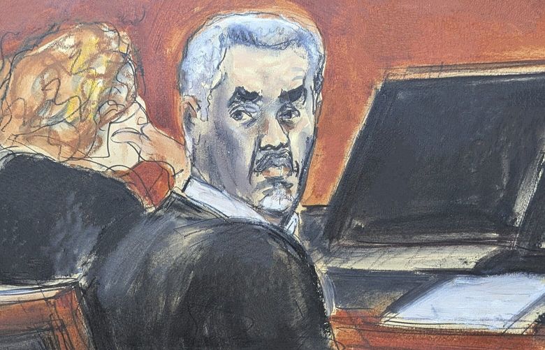 Sean ‘Diddy’ Combs, right, turns around and looks at the audience during jury selection at Manhattan federal court, Monday, May 5, 2025, in New York. (Elizabeth Williams via AP) NYJJ103 NYJJ103