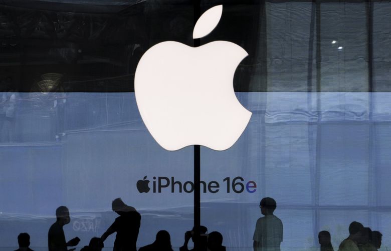 People visit an Apple Store promoting its iPhone 16 at an outdoor shopping mall in Beijing, Sunday, May 11, 2025. (AP Photo/Andy Wong) XAW106 XAW106 (Andy Wong / The Associated Press)