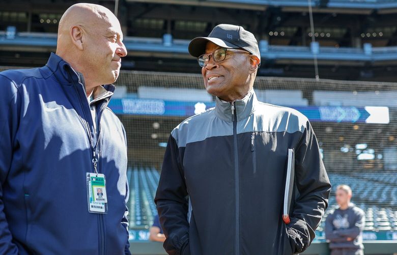 Former Mariner broadcaster Dave Sims, right, visits with Dave Valle before the start of Monday’s game with the New York Yankees – Sims’ new broadcast gig.  The New York Yankees played the Seattle Mariners in Major League Baseball Monday, May 12, 2025 at T-Mobile Park, in Seattle, WA. 230028