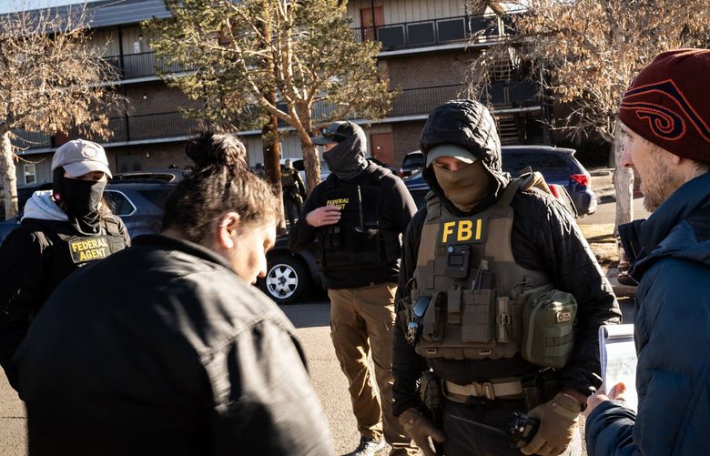 FILE — FBI agents at an immigration raid in Denver, Feb. 5, 2025. A new Trump administration directive would be a noticeable shift in the typical work of the FBI in immigration enforcement. (Chet Strange/The New York Times) XNYT0777 XNYT0777