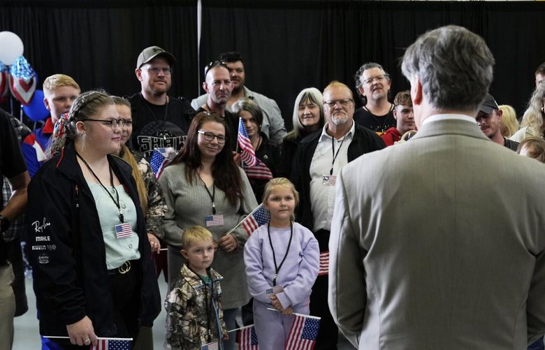 Deputy Secretary of State Christopher Landau greets Afrikaner refugees from South Africa, Monday, May 12, 2025, at Dulles International Airport in Dulles, Va. (AP Photo/Julia Demaree Nikhinson) VAPU553 VAPU553