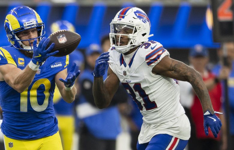 Los Angeles Rams wide receiver Cooper Kupp (10) catches the ball over Buffalo Bills cornerback Rasul Douglas (31) during an NFL football game, Sunday, Dec. 8, 2024, in Inglewood, Calif. (AP Photo/Kyusung Gong)