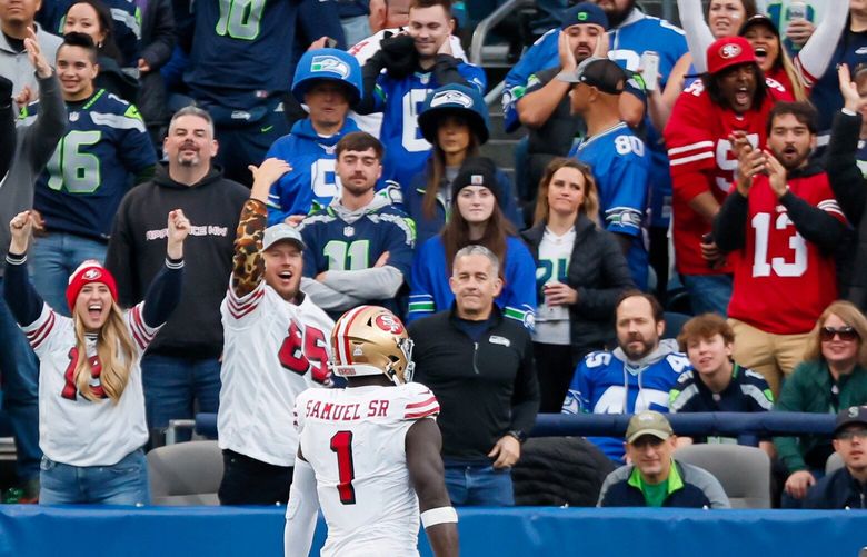 San Francisco 49ers fans outnumber Seattle Seahawks fans as wide receiver Deebo Samuel Sr. scores a touchdown during the first quarter Thursday, Oct. 10, 2024 in Seattle. 228206