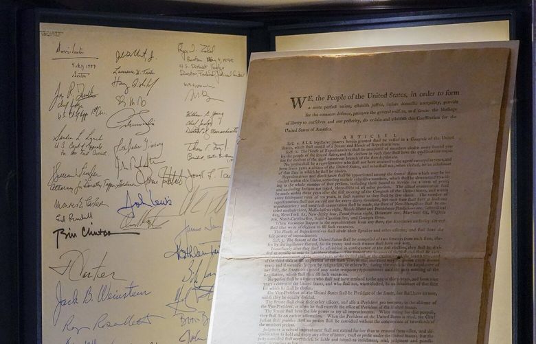 FILE – A first printing of the United States Constitution is displayed at Sotheby’s auction house during a press preview on Nov. 5, 2021, in New York. (AP Photo/Mary Altaffer, File) FRS102 FRS102