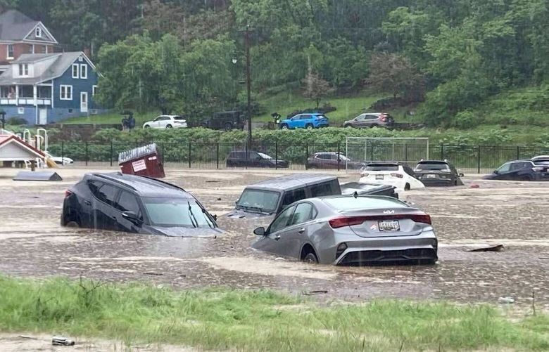In this photo provided by Alley and Tim Wade, cars can be seen in floodwaters in Westernport, Maryland on Tuesday, May 13, 2025. (Alley and Tim Wade via AP) NYWS304 NYWS304