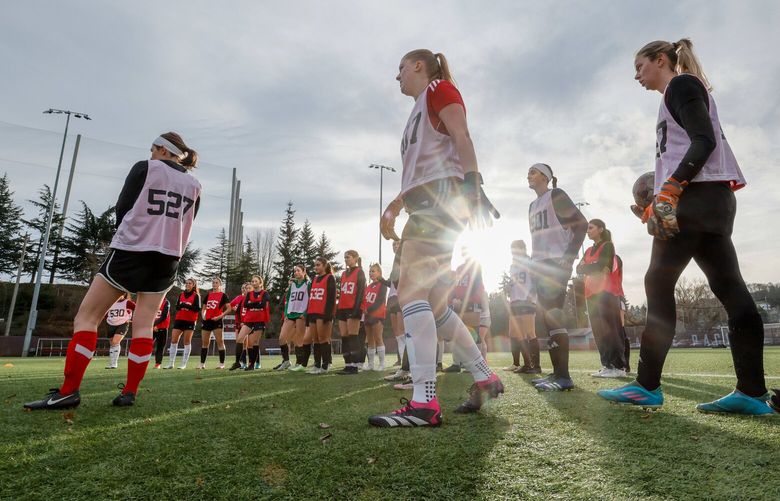 The sun shines briefly as a group of prospective players gather before try-outs for the inaugural Salmon Bay FC soccer team Saturday, Dec. 28, 2024 at Interbay Stadium in Seattle. 228874
