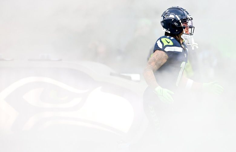 Seattle Seahawks wide receiver Jaxon Smith-Njigba comes out of the smoke during player introductions Sunday, Dec. 22, 2024 in Seattle. 228897
