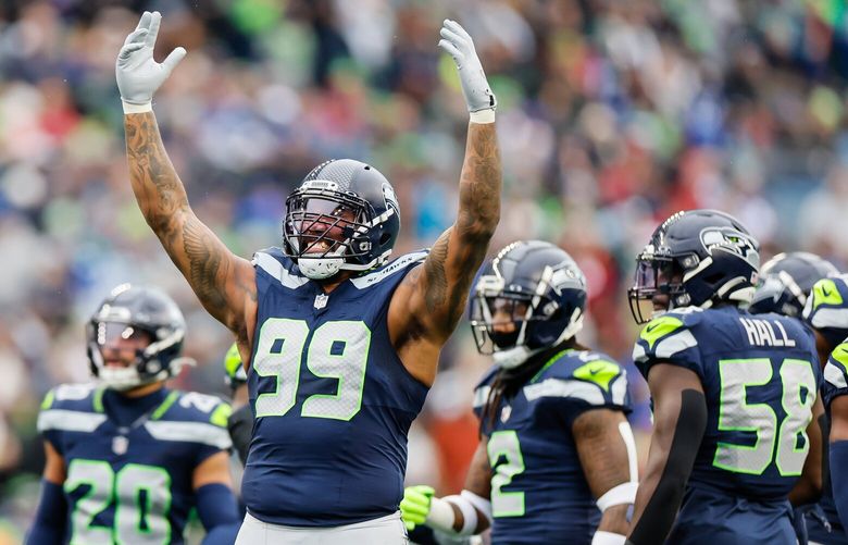 Seattle Seahawks defensive end Leonard Williams urges the crowd for noise during the first quarter Sunday, Nov. 24, 2024 in Seattle. 228598