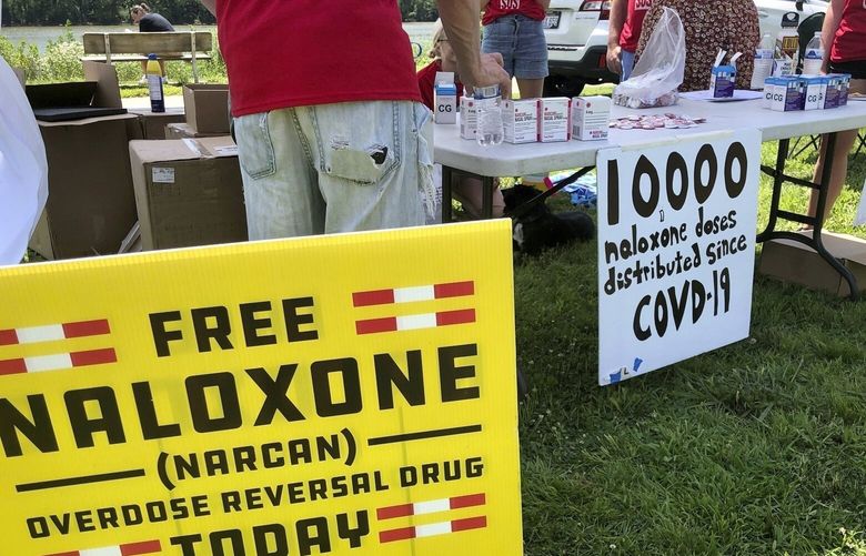 FILE – Signs are displayed at a tent during a health event on June 26, 2021, in Charleston, W.Va. (AP Photo/John Raby, File) NYSS104 NYSS104