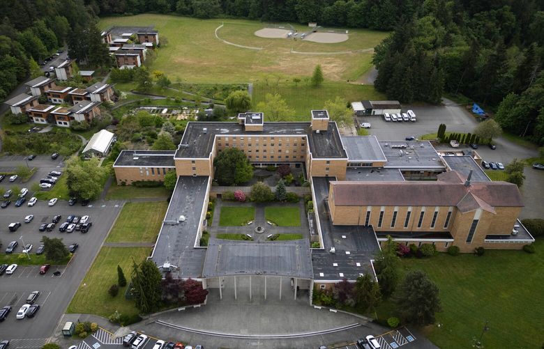Facing financial trouble, Bastyr University plans to sell its main Seattle-area campus in Kenmore, seen Wednesday, May 14, 2025, then lease back its buildings from the new owner.