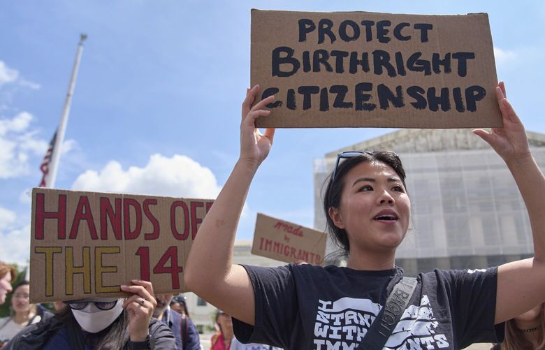 Hannah Liu, 26, of Washington, holds up a sign in support of birthright citizenship, Thursday, May 15, 2025, outside of the Supreme Court in Washington. “This is enshrined in the Constitution. My parents are Chinese immigrants,” says Liu. “They came here on temporary visas so I derive my citizenship through birthright.” (AP Photo/Jacquelyn Martin) DCJM103 DCJM103