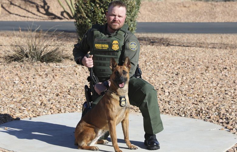 FILE – In this undated and unknown location photo released by the Department of Homeland Security shows Border Patrol Agent David Maland posing with a service dog. (Department of Homeland Security via AP, File) llt103 llt103
