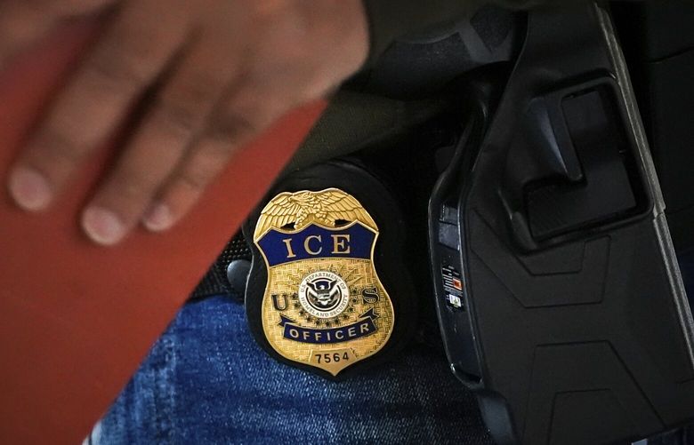 FILE – A deportation officer with Enforcement and Removal Operations in U.S. Immigration and Customs Enforcement’s New York City field office conducts a brief before an early morning operation, Tuesday, Dec. 17, 2024, in the Bronx borough of New York. (AP Photo/Julia Demaree Nikhinson, File) NY110 NY110