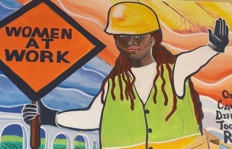 A mural by artist Tene Smith is seen near the entrance of Chicago Women in Trades, a nonprofit dedicated to training and retaining women in the skilled construction trades, is shown on April 1, 2025, at the facility in Chicago. (Tene Smith via AP) NYPS318 NYPS318