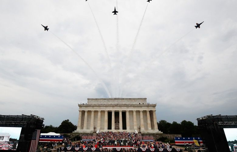 FILE – President Donald Trump, first lady Melania Trump, Vice President Mike Pence and Karen Pence and others stand as the US Army Band performs and the US Navy Blue Angels flyover at the end of an Independence Day celebration in front of the Lincoln Memorial, July 4, 2019, in Washington. (AP Photo/Alex Brandon, File) WX104 WX104