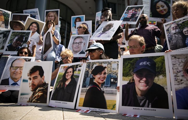 Family members of victims from the Ethiopian Airlines Flight 302 crash hold photographs during a vigil outside the Department of Transportation in Washington, D.C., U.S., on Tuesday, Sept., 10, 2019. Two crashes within five months — Lion Air Flight 610 in October 2018 off the coast of Indonesia and Ethiopian Airlines Flight 302 in March outside Addis Ababa — killed 346 people and led to a global grounding of Boeing Co.’s 737 Max jets. Photographer: Al Drago/Bloomberg