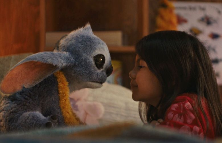 Stitch and Maia Kealoha as Lilo in “Lilo & Stitch.”